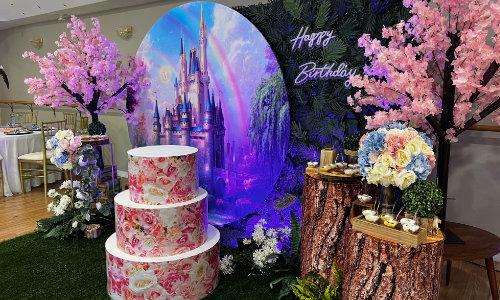 Enchanted Forest Fairytale Quinceanera Celebration with tree trunk stands
