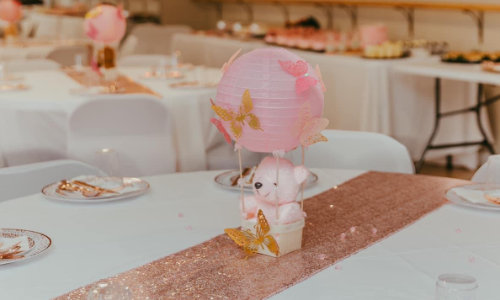 Rose pink bear baby shower with bear balloons and gold throne